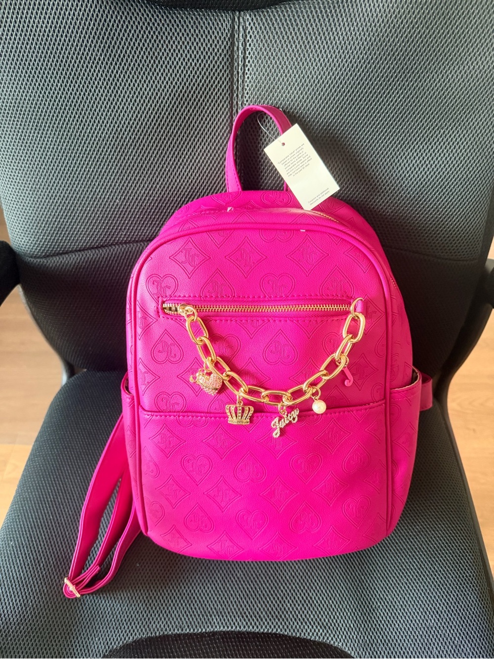 Juicy Couture Vibrant Pink Embossed Backpack with Gold Charm Chain